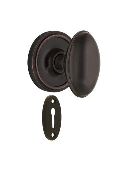 Classic Rosette Mortise-Lock Set with Homestead Knobs in Timeless Bronze.